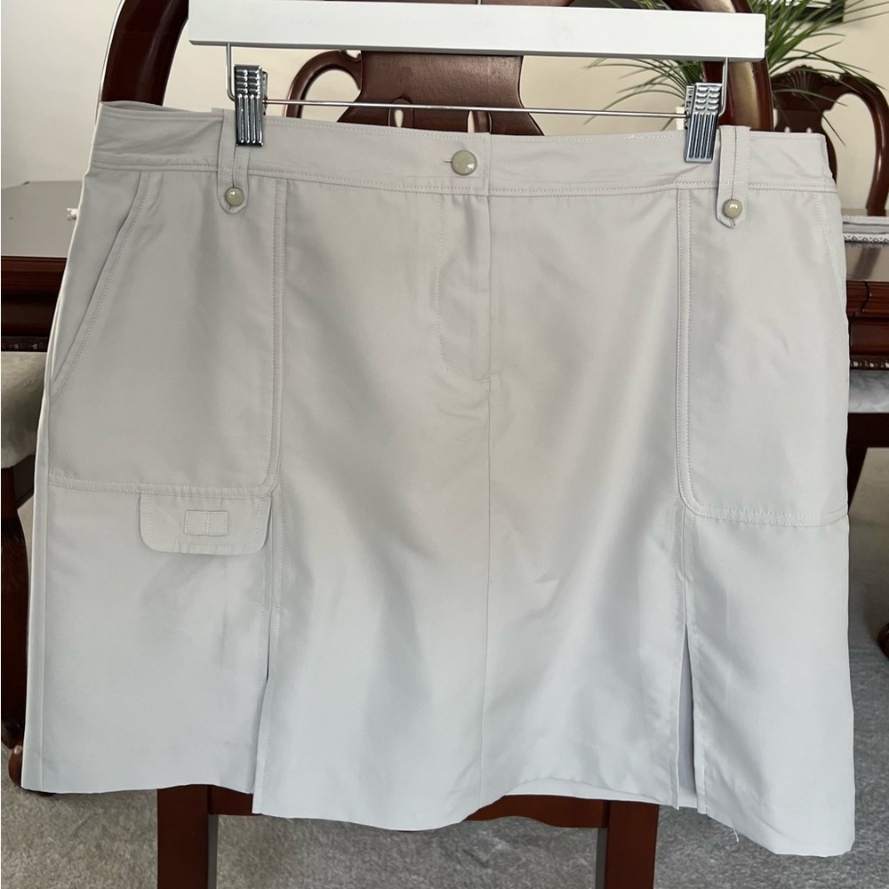 Women’s Izod golf skirt, sand color size 14
